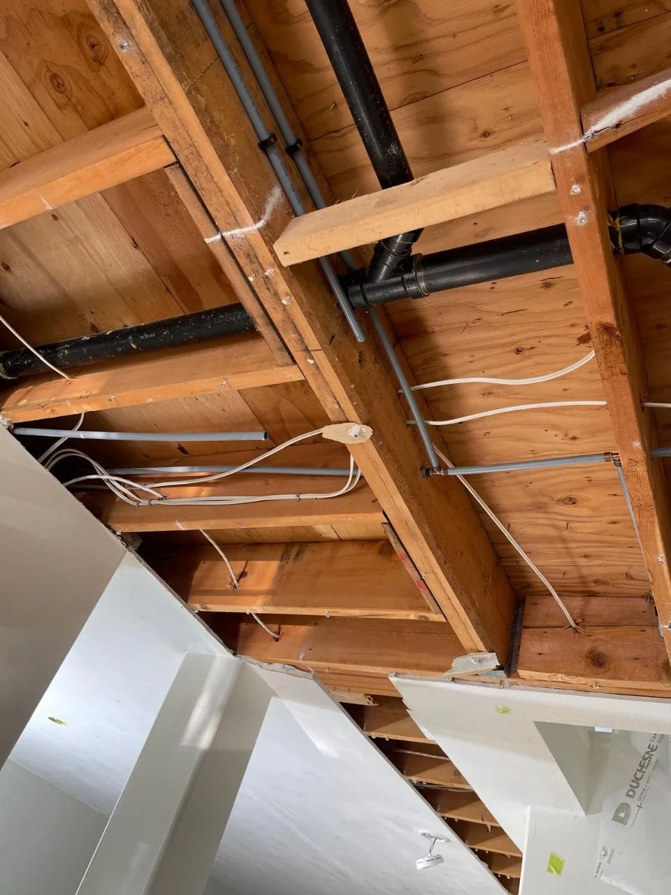 Exposed water and drain pipes during a Poly-B replacement